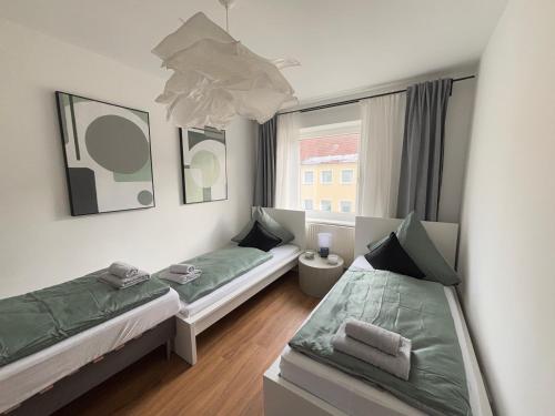 Postel nebo postele na pokoji v ubytování 3 Zimmer - city -Parkplatz - MalliBase Apartments