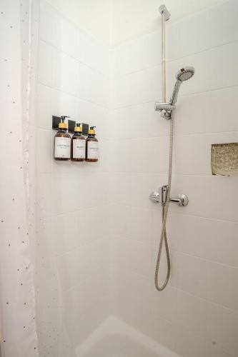 a bathroom with a shower with a shower head at Apartment Weserblick in Hameln