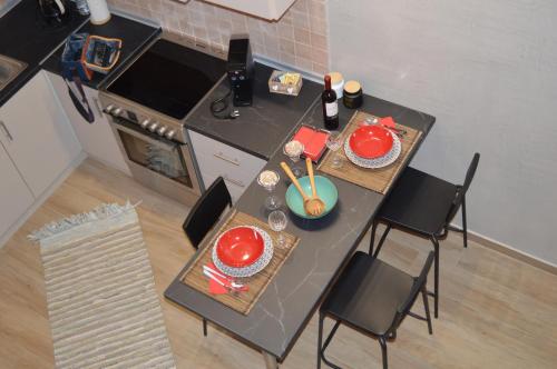 an overhead view of a kitchen with a table and chairs at The loft heaven in Katerini