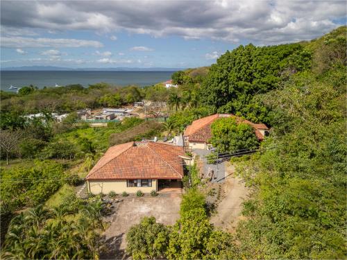 an aerial view of a house on a hill at Villa Sunset - Your Sunshine Escape! in Ocotal