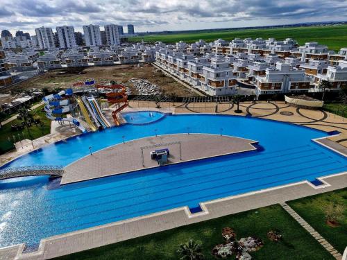 an overhead view of a large swimming pool in a city at Sunny escape Holiday apartment in İskele