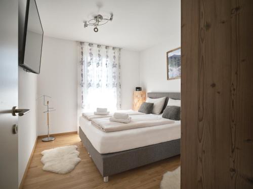 Ένα ή περισσότερα κρεβάτια σε δωμάτιο στο Apartment Kumitzblick