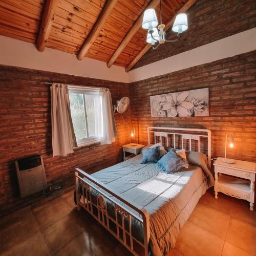 Ένα ή περισσότερα κρεβάτια σε δωμάτιο στο Cabañas Estilo RG