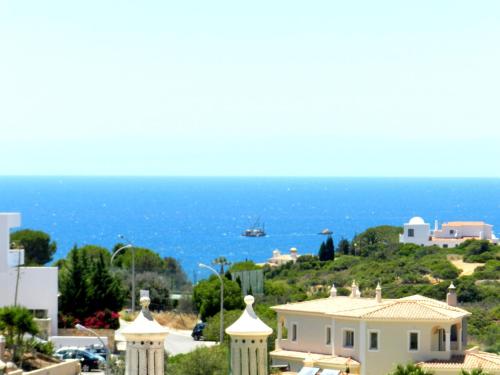 a view of the ocean from a house at Algarve's Holiday Home with Sea View in Ferragudo