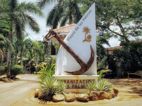 a sign in front of a resort with a snake at Pineapple Condo At Villa Riviera in Coco