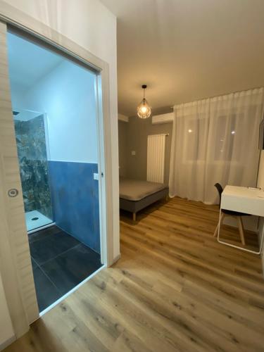 a living room with a large sliding glass door at Colibrì Art B&B in San Martino in Argine