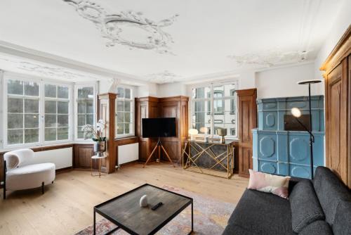 a living room with a couch and a table at The R Apartment Randen in Schaffhausen