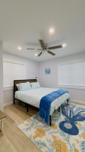 a bedroom with a bed and a ceiling fan at My Cozy Beach House Cape May Court House NJ Pool Near Wildwood and Cape May in Whitesboro