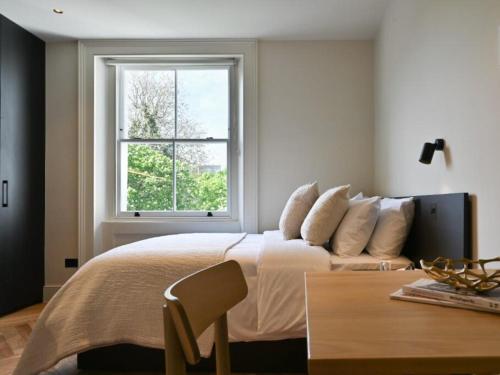 Ένα ή περισσότερα κρεβάτια σε δωμάτιο στο Central London Ensuite, Exclusive Experiences
