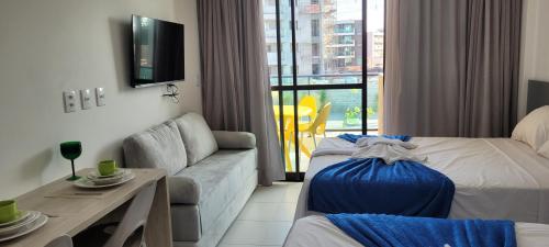 Ένα ή περισσότερα κρεβάτια σε δωμάτιο στο Refúgio By Paty - Malia Beach Studio Porto de Galinhas Muro Alto - Família