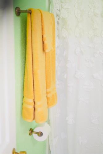 an orange towel hanging on a towel rack in a bathroom at Quiet and comfort at its best in Temple