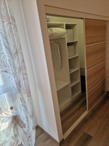 a closet with a mirror in a room at Bed & Breakfast L'Incanto Intero Appartamento in Pisa