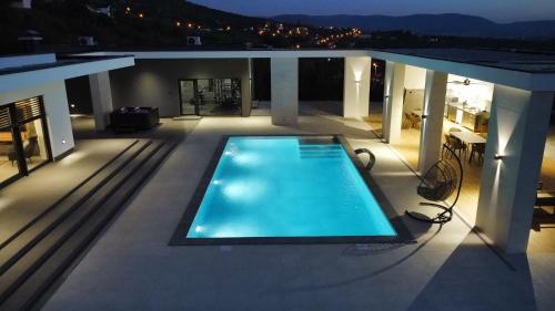 a swimming pool on the roof of a house at Alta Vista residence&spa in Mostar
