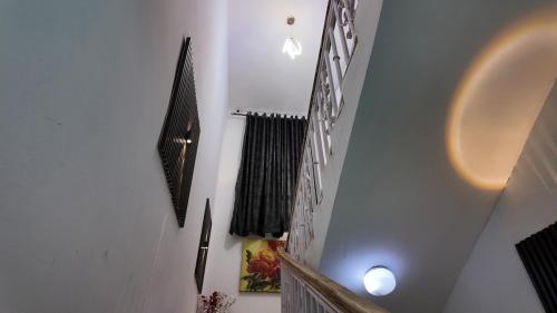 a staircase in a house with black and white walls at Sultan Apartments Lagos in Lagos