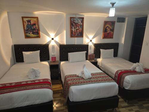 Ένα ή περισσότερα κρεβάτια σε δωμάτιο στο TAYWA HOTEL