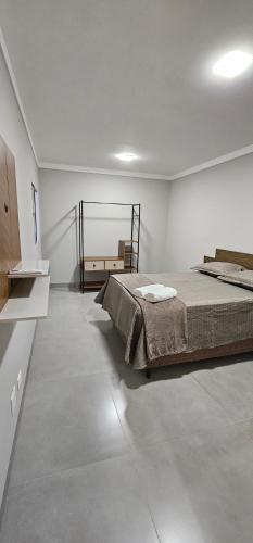Ένα ή περισσότερα κρεβάτια σε δωμάτιο στο Casa 05 - Condomínio Solar dos Ipês