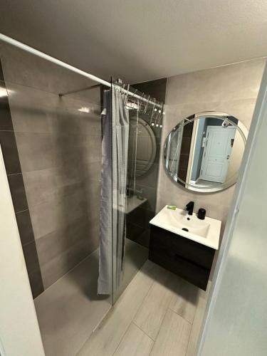 a bathroom with a sink and a mirror at Fuertevida in Caleta De Fuste