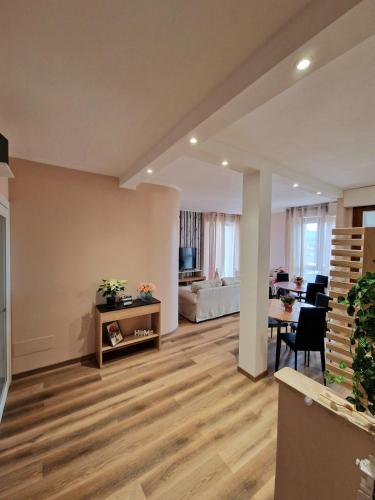 a living room with a table and a dining room at Bed & Breakfast L'Incanto Intero Appartamento in Pisa