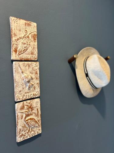 two ties with a hat on a table at OCEAN VIEW GETAWAY! Penthouse Studio in Punta de Mita! in Punta Mita