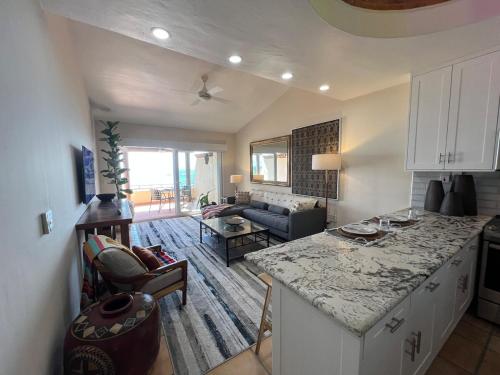 a kitchen and living room with a large counter top at OCEAN VIEW GETAWAY! Penthouse Studio in Punta de Mita! in Punta Mita