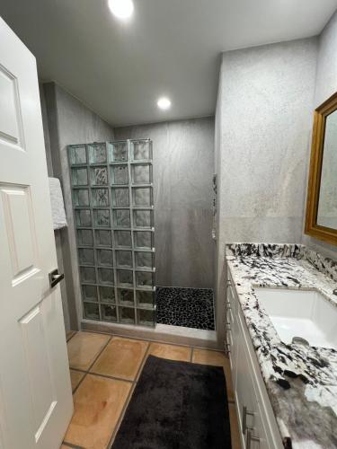 a bathroom with a sink and a shower at OCEAN VIEW GETAWAY! Penthouse Studio in Punta de Mita! in Punta Mita