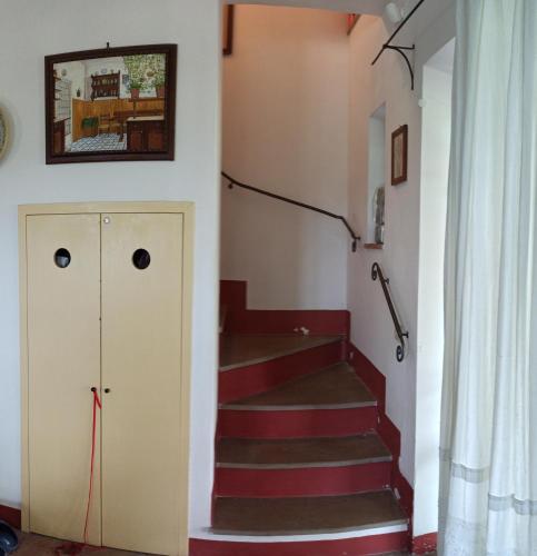 a staircase in a house with a stair case at Agriturismo Casa Greppo in San Venanzo
