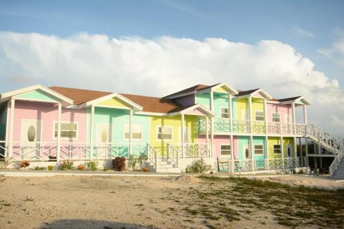 a row of colorful houses on the beach at Exuma Beach Point in Rolleville