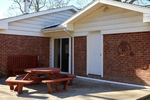 a picnic table and two benches on a patio at The Higashi King bed mountain home in New Paltz in New Paltz