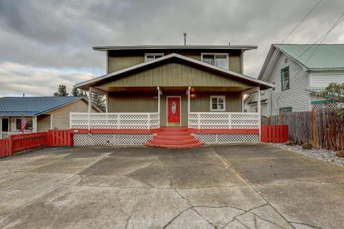 a house with a red door and a red fence at Northern Lights in White Salmon
