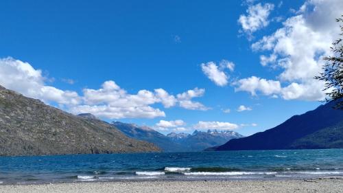 a view of a lake with mountains in the background at Patagonia Azul Hostel Boutique in Lago Puelo