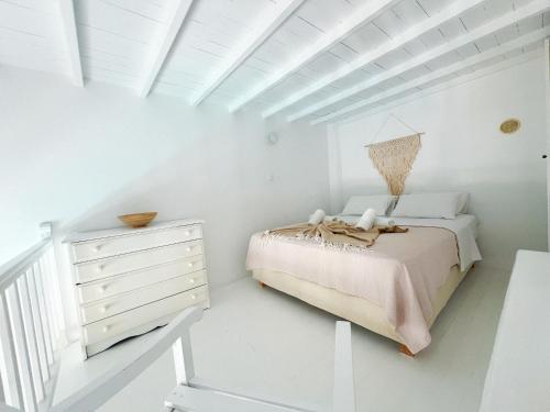 Ένα ή περισσότερα κρεβάτια σε δωμάτιο στο Kamara Residence & Suites