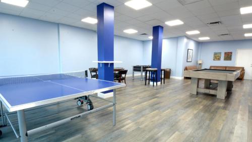 a room with a ping pong table in it at 409 Mariners Club in Key Largo