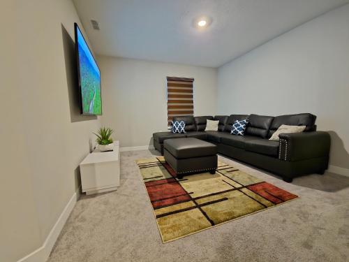 a living room with a couch and a table at Cozy 5 bedroom and 4 bathroom in Brownsburg