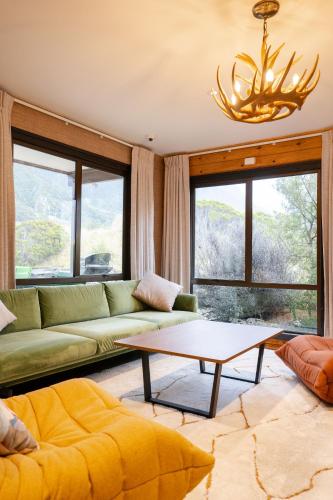 a living room with a couch and a table at Haka House Aoraki Mt Cook in Mount Cook Village