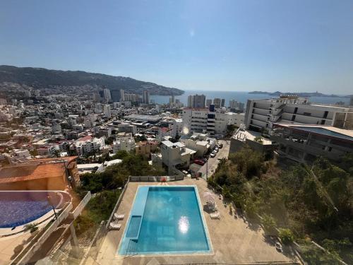 Bazén v ubytování Departamento en Lomas de Costazul nebo v jeho okolí