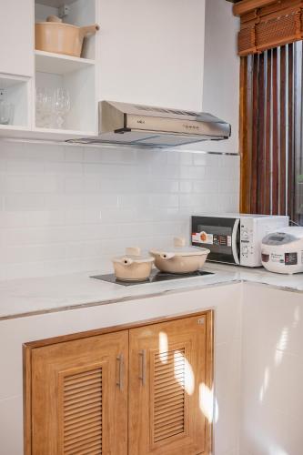 a kitchen with two bowls on top of a counter at Thongkwao house in Chiang Mai