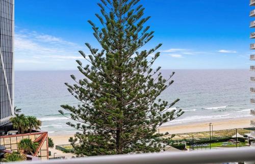 a christmas tree in front of the beach at Wharf Boutique Apartments in Gold Coast