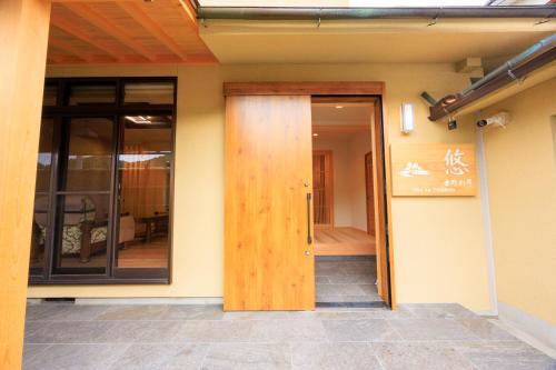 an open door of a building with a glass door at 悠吉野別邸VillaYuYOSHINO in Yoshino