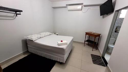 En eller flere senge i et værelse på Rancho Tertúlia Lago Corumbá IV