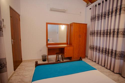 a dressing room with a mirror and a dressing table at Sea Breeze Coast - Stay in Kamburugamuwa