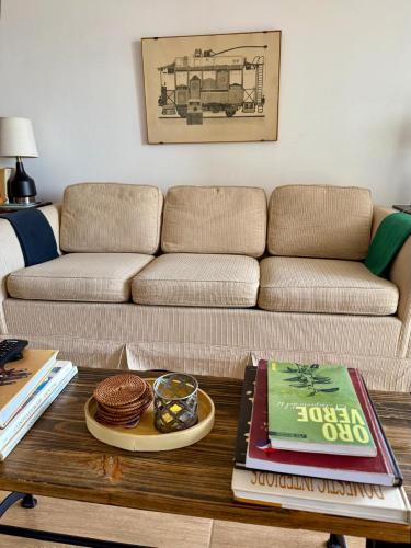 a living room with a couch and a coffee table at Best location ! Apt privado 2 hab con AC Completamente equipado en Asuncion in Asuncion