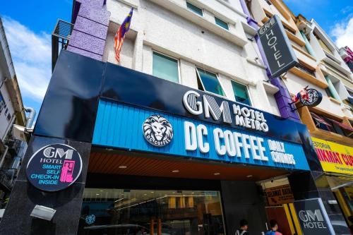 a building with a dog centre sign on it at GM Hotel Metro at Sunway in Petaling Jaya