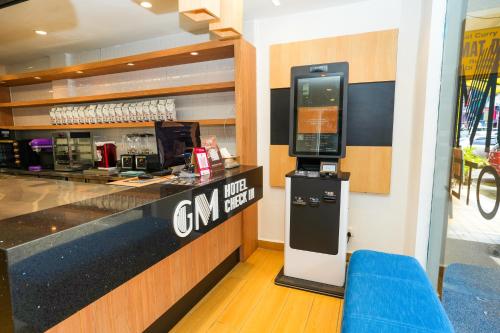 a cash counter in a restaurant with a cash register at GM Hotel Metro at Sunway in Petaling Jaya