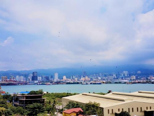 a view of a city with a large body of water at Cebu stays-Saekyung 956 Condominium unit 1209 in Lapu Lapu City