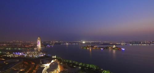 a view of a large body of water at night at InterContinental Suzhou Hotel by IHG in Suzhou