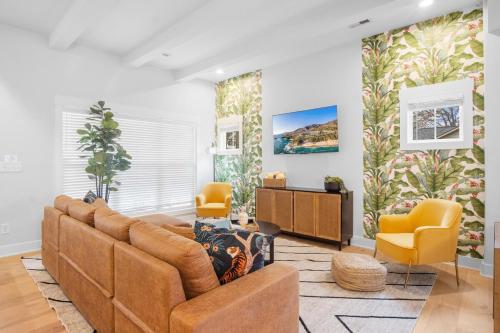 a living room with a couch and two chairs at Near BoA Stadium, 5 Bedroom with Games, Backyard in Charlotte