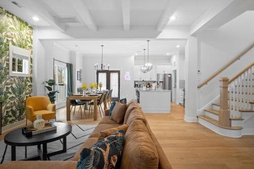 a living room with a couch and a dining room at Near BoA Stadium, 5 Bedroom with Games, Backyard in Charlotte