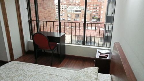 Ένα ή περισσότερα κρεβάτια σε δωμάτιο στο Confort mejor Ambiente familiar