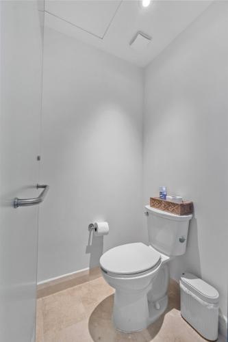 a bathroom with a toilet and a glass shower at Zantamar 2B 2B Luxury Apartment on the Beach in Cruz de Huanacaxtle