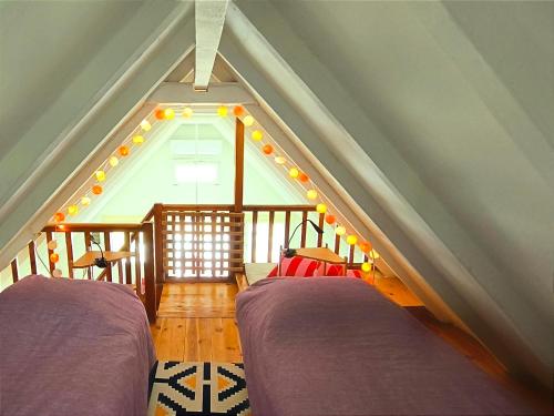 a room with two beds in a attic at Seaside Glow in Schinias